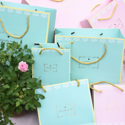 Sacos de papel decorativos elegantes, papel revestido com UV sacos de compras com alças